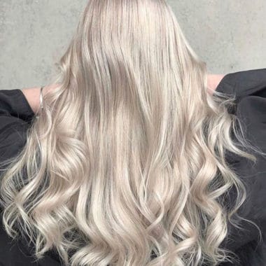 Lush, healthy blonde long hair. Freshly toned with MUVO Ultra Blonde Conditioner.