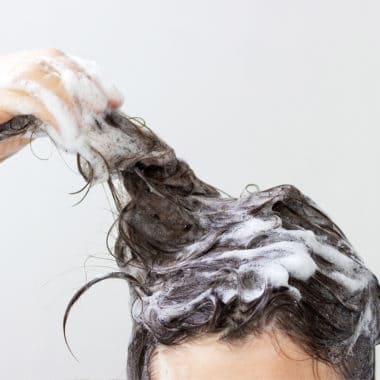 Women washing hair with Deep Cleansing Shampoo