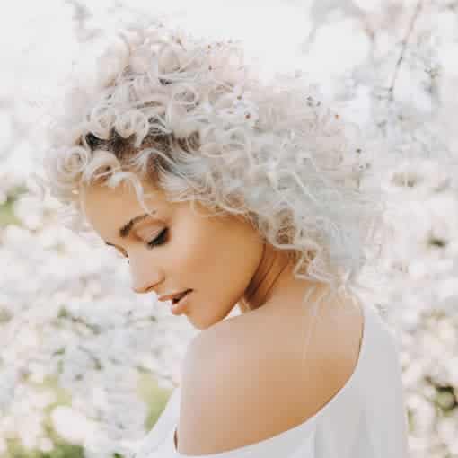 Lady with Platinum blonde curly hair