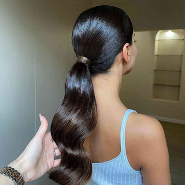 back view of girl with log brown pony tail